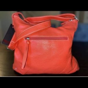 Red by Marc Ecko Pizazz Sling with Studs in Orange with White Accents